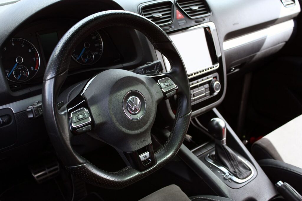 The Art of Drawing Readers In: Your attractive post title goes here Explore the sleek interior and dashboard of a modern Volkswagen car, showcasing advanced features and design.